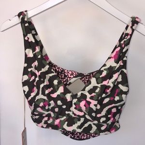 Maaji reversible sports bra in pink/green camo then forest/pink floral.